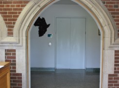 View of New Elevator Lobby through retained gothic archway